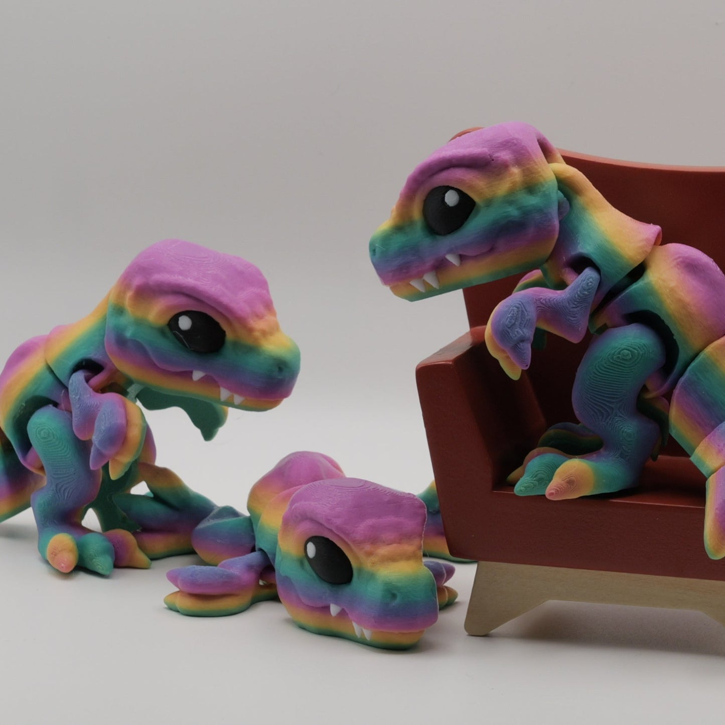 Colorful toy lizards on a white background