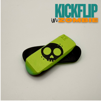 Green and black boards with skull design on a light gray background, featuring 'KICKFLIP in ZOMBIE' text.